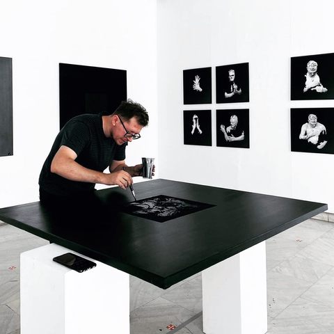 Robert working on a print at the gallery